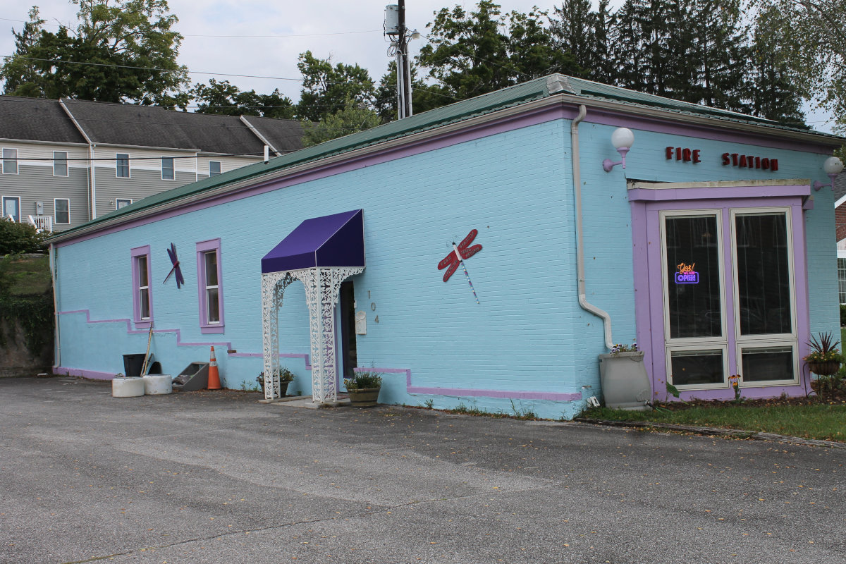 The turquoise Art and Soul Creative Reuse Center building, a converted fire station in Radford, VA